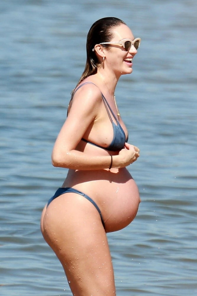 Pregnant celebrities in the beach #104315083