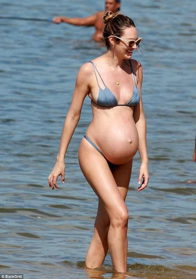 Pregnant celebrities in the beach #104315090