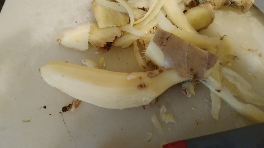 Carving a hand of ginger for figging #88839323