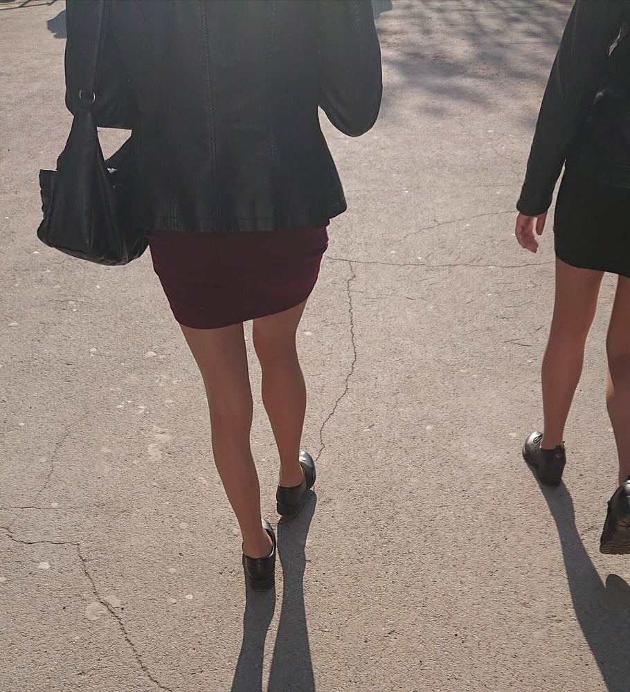 Two whores in pantyhose on the street #97264920