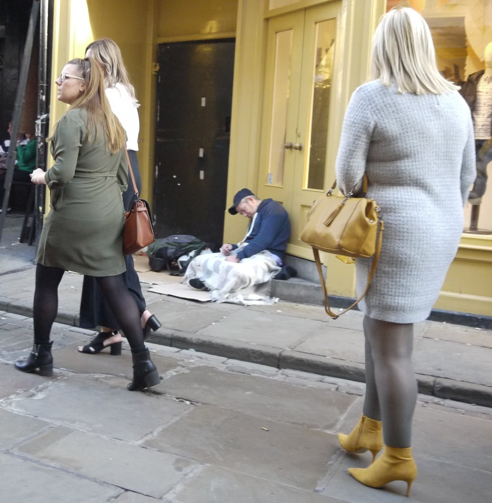 blonde in grey dress with grey pantyhose and yellow heels #99373040