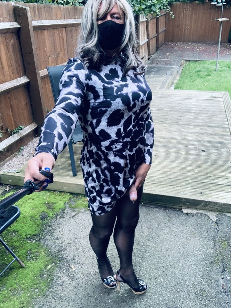 Kelly in leopard pattern dress black tights and heels #106913806