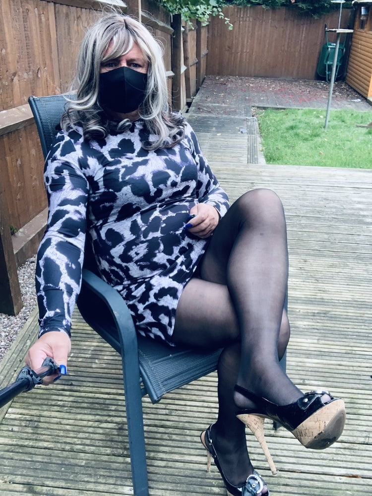 Kelly in leopard pattern dress black tights and heels #106913862