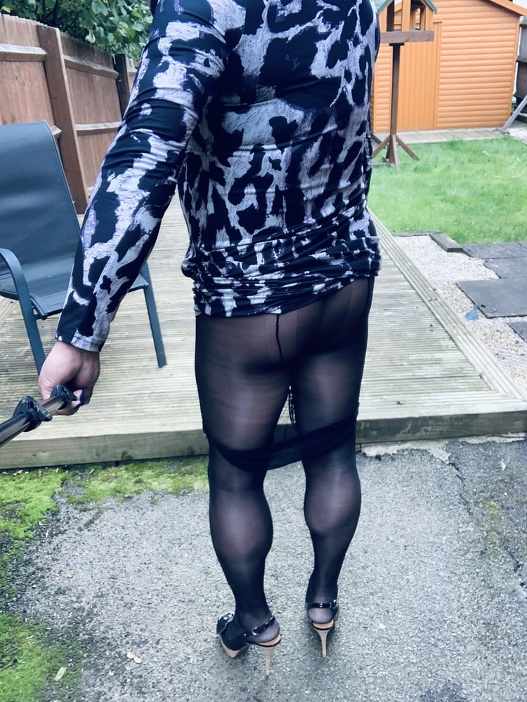 Kelly in leopard pattern dress black tights and heels #106913868
