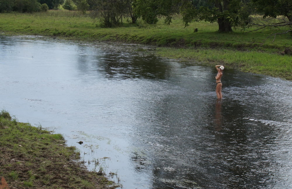 Nude in river's water #106939128