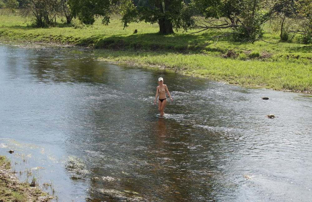 Nude in river's water #106939135