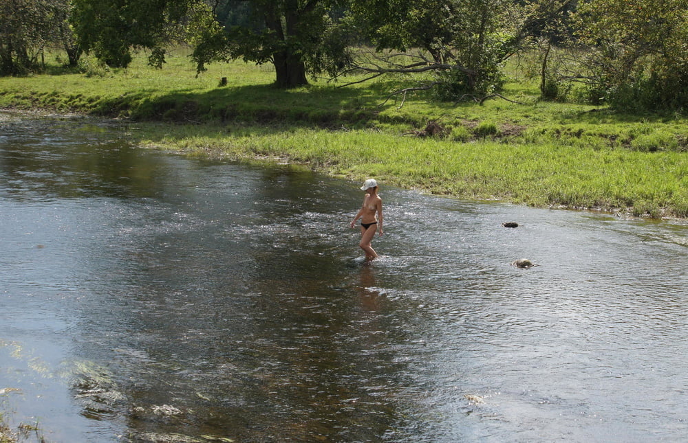 Nude in river's water #106939136