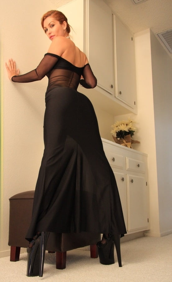 Girl posing in long black dress and platform heels
 #88994440