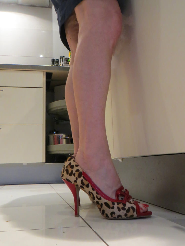 Wife within the kitchen with Bronx heels