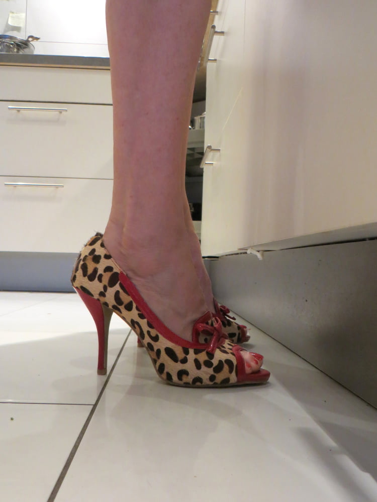 Wife in the kitchen with Bronx heels #106841700