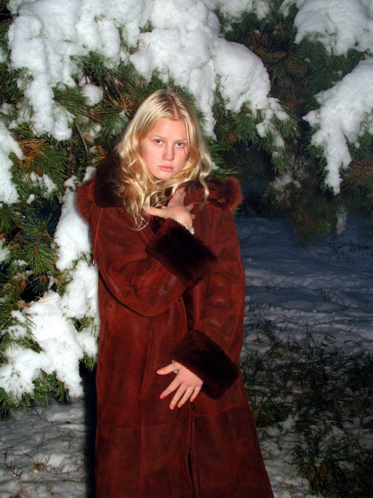 Nice blonde in fur coat posing #102729751