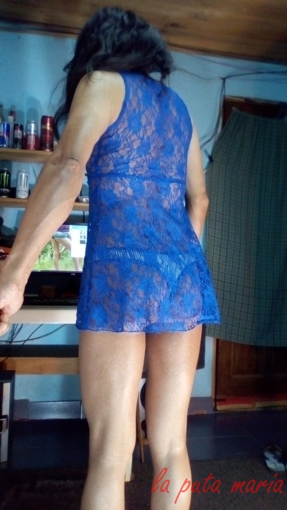 the whore maria wearing a blue dress #106678151