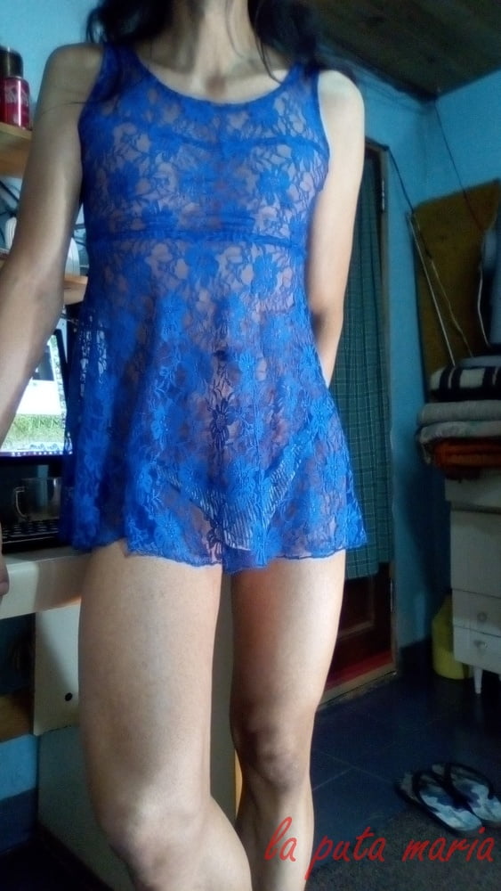 the whore maria wearing a blue dress #106678161