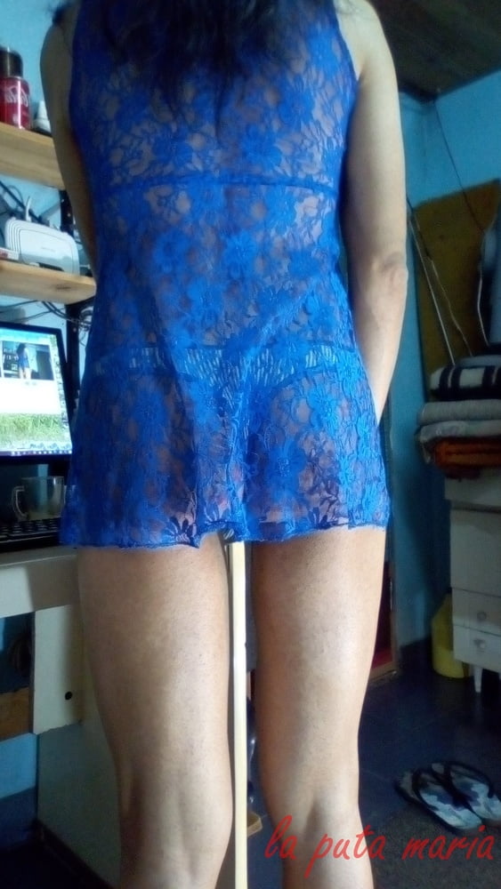 the whore maria wearing a blue dress #106678162