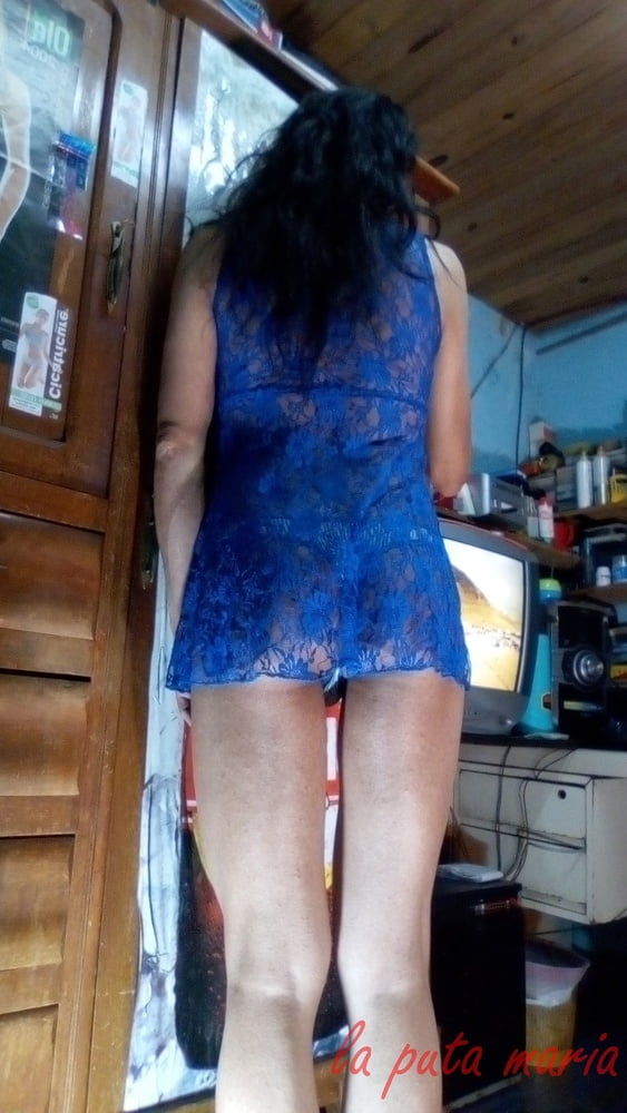 the whore maria wearing a blue dress #106678163