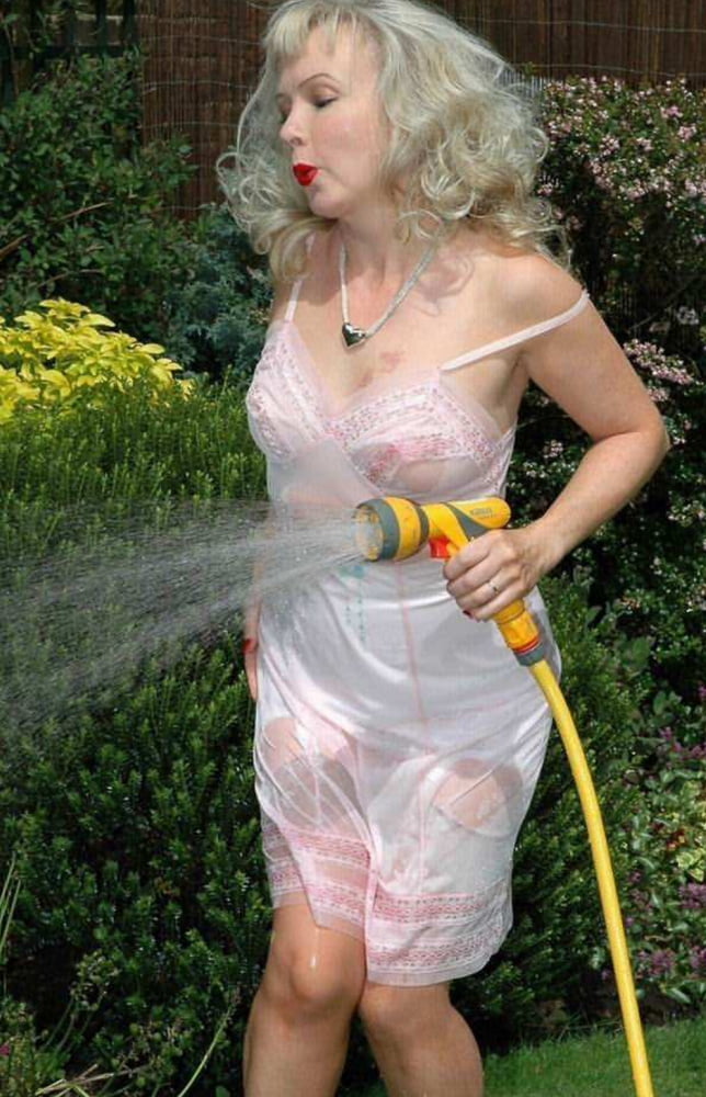 Sue wets her slip in the garden #103667441
