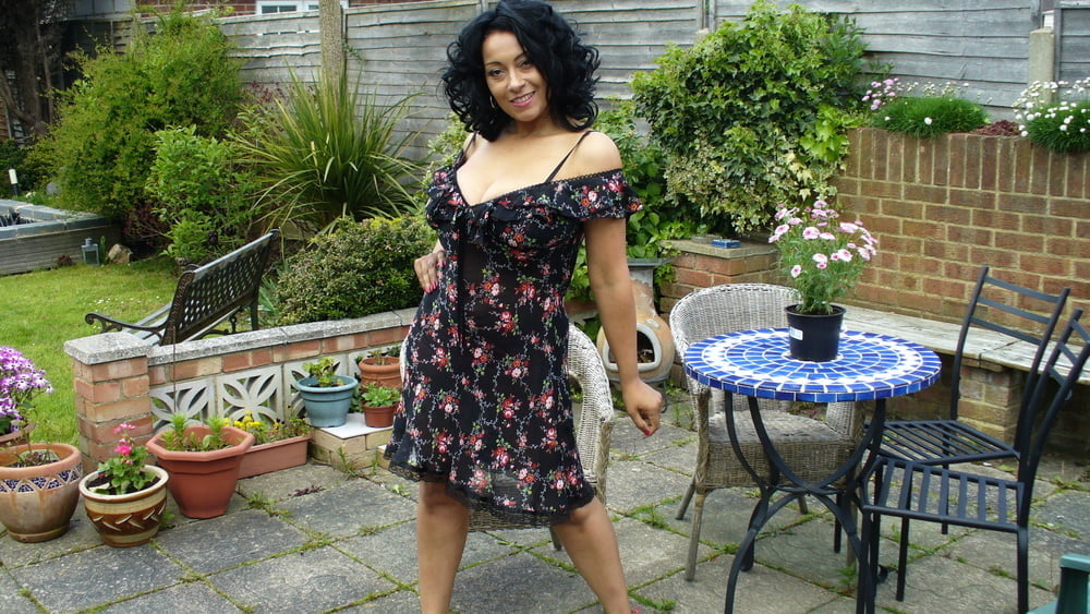 Donna Ambrose Wearing Printed Dress On The Patio Non Nude #95145769