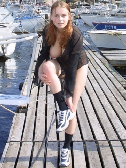 Very busty girl posing at public pier #100613482