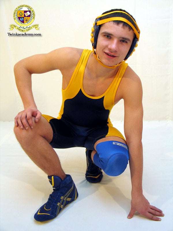 Marty poses in and out of his wrestling singlet #106885113