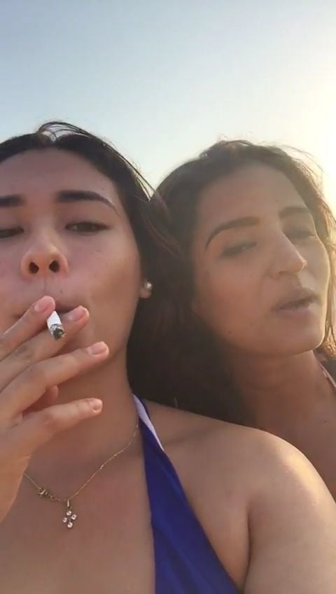 Smoking Kelly Cuesta on beach with lez gf #103943204
