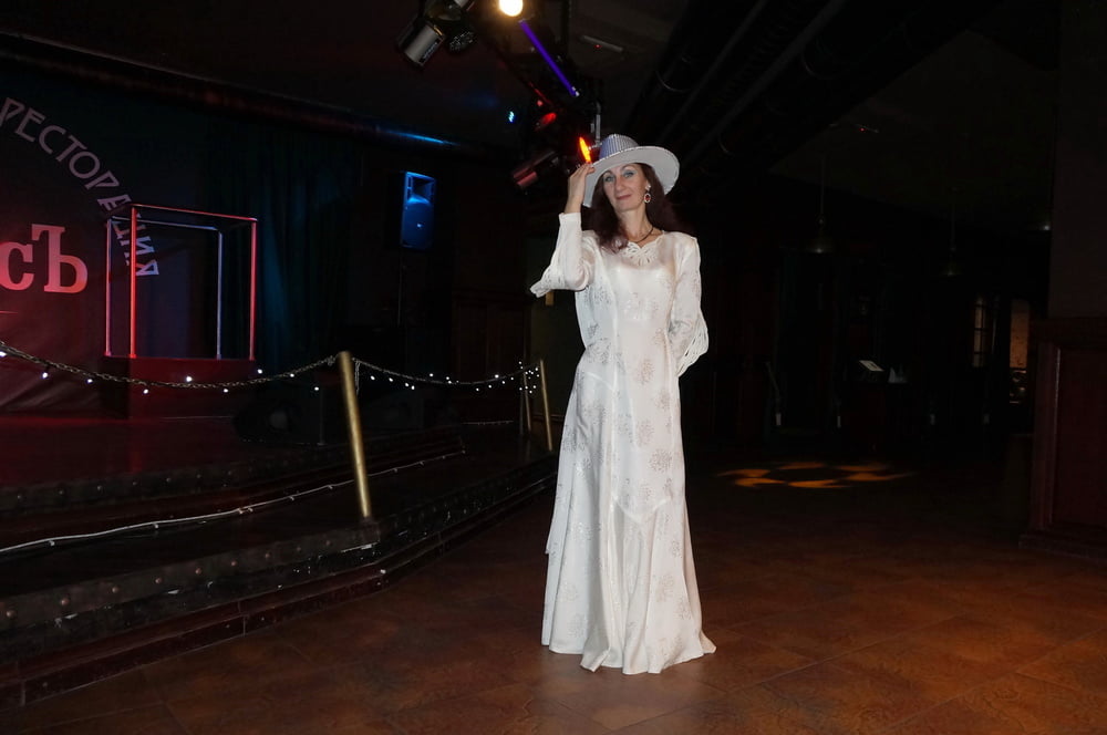 In Wedding Dress and White Hat on stage #106861186