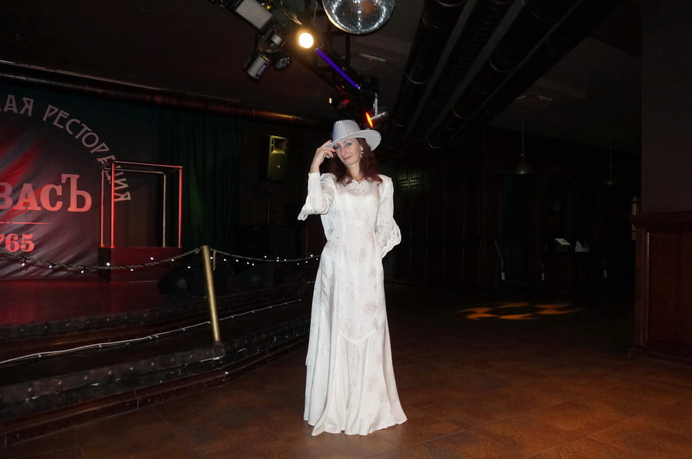 In Wedding Dress and White Hat on stage #106861188