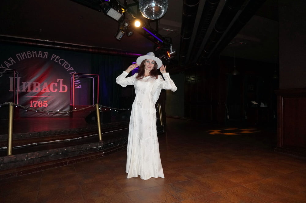 In Wedding Dress and White Hat on stage #106861189