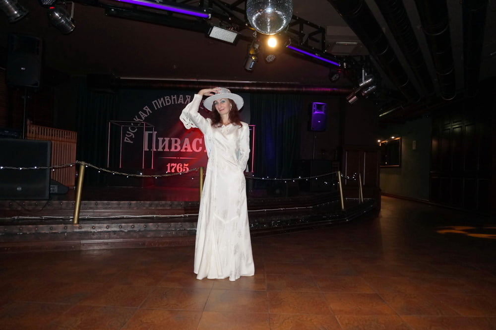 In Wedding Dress and White Hat on stage #106861190