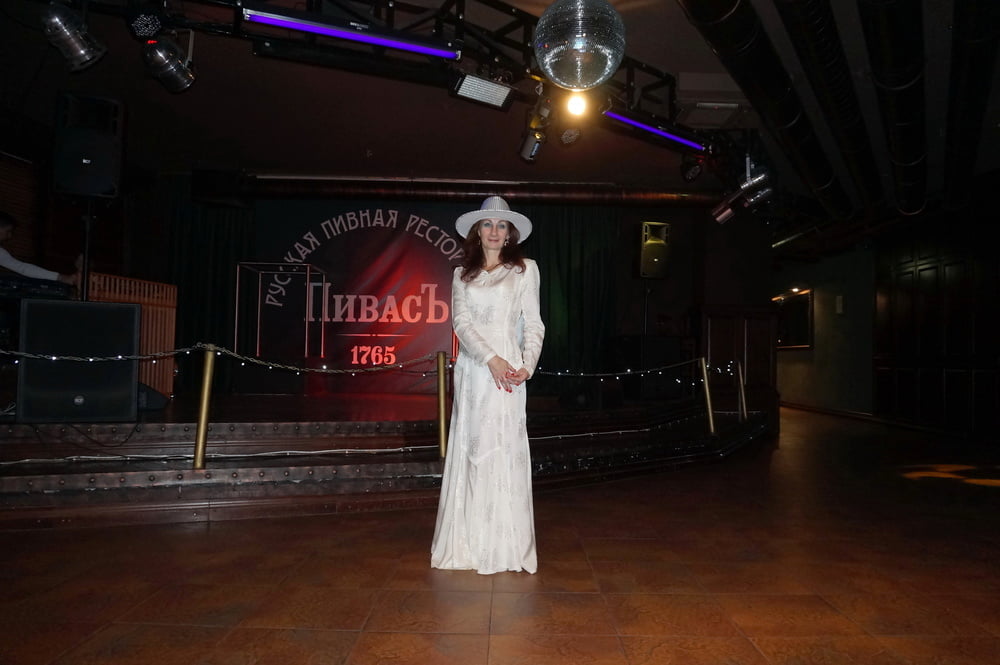 In Wedding Dress and White Hat on stage #106861191