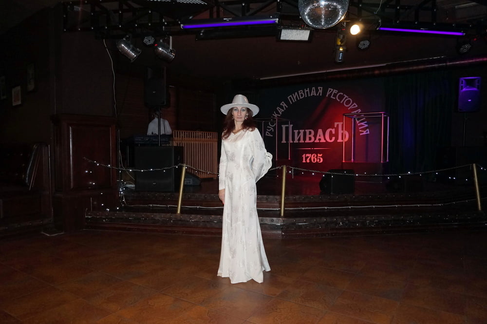 In Wedding Dress and White Hat on stage #106861193