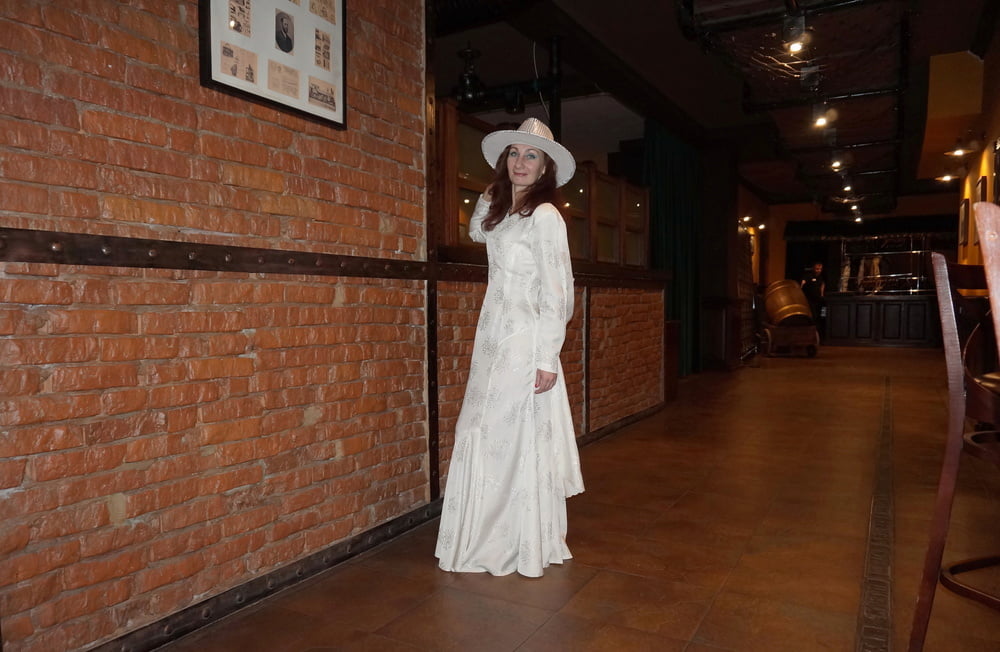 In Wedding Dress and White Hat on stage #106861208