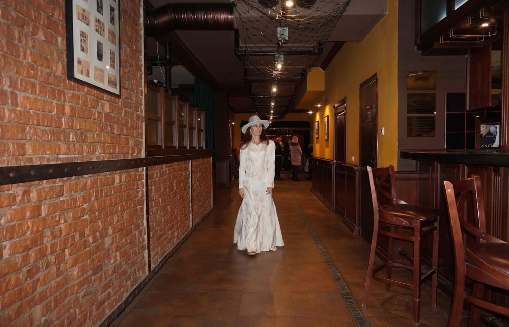 In Wedding Dress and White Hat on stage #106861212