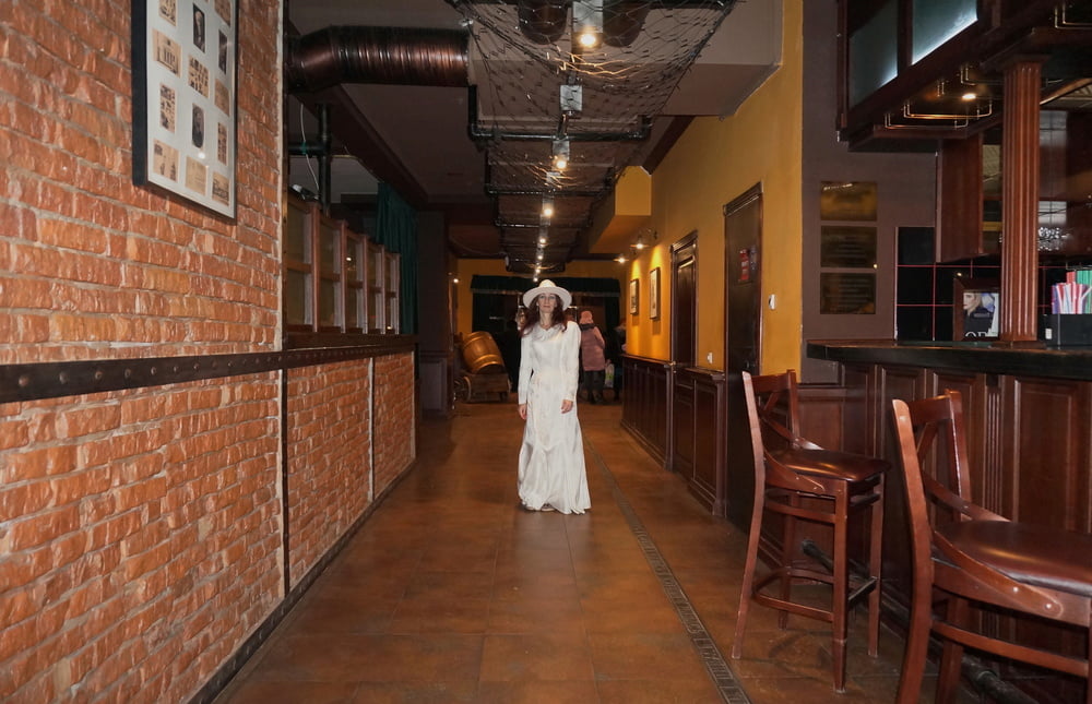 In Wedding Dress and White Hat on stage #106861213