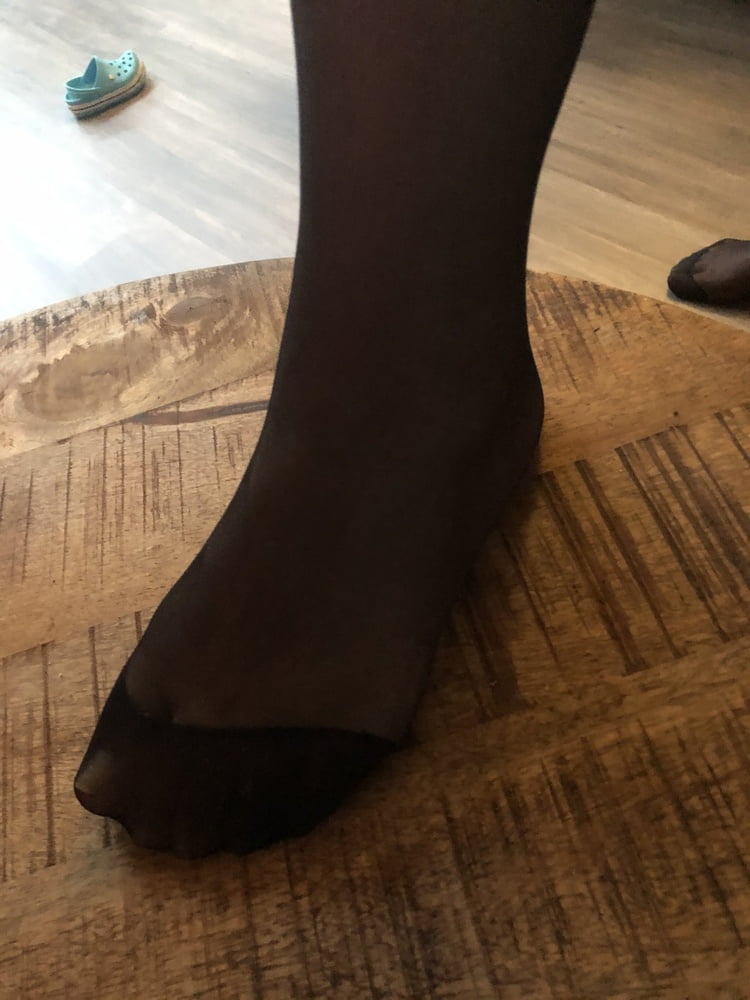 Feet in black stockings #91314325