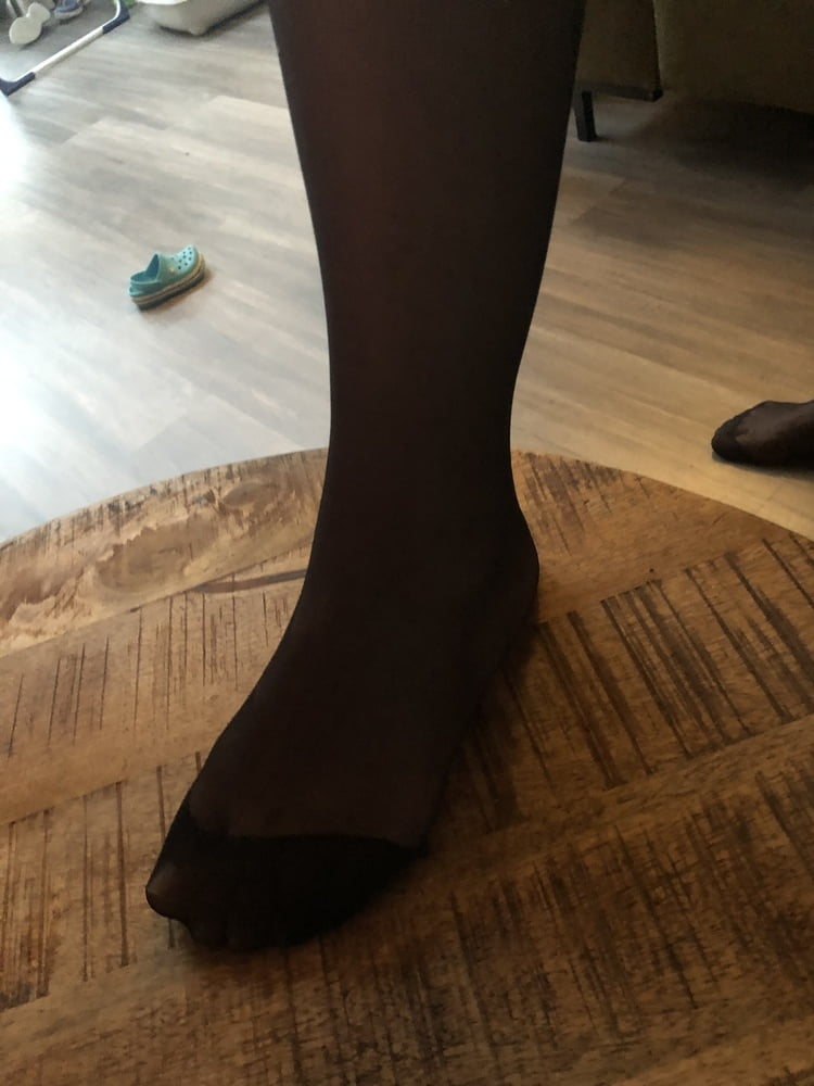 Feet in black stockings #91314328