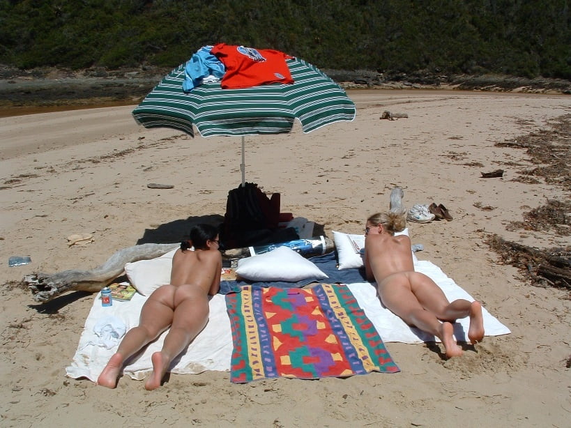 Fun at the beach with our nudist friends. #90419256