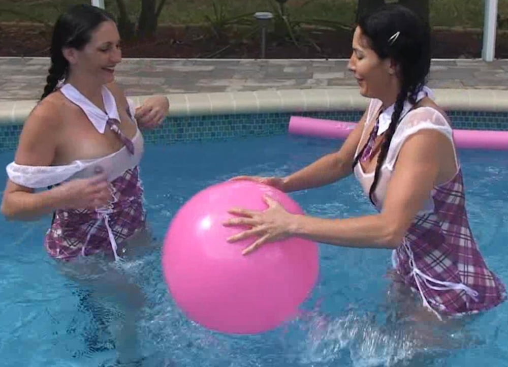 Sisters play in the pool #96601225