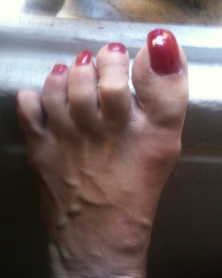 red toenails mix (older, dirty, toe ring, sandals mixed). #106916267