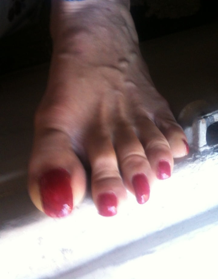 red toenails mix (older, dirty, toe ring, sandals mixed). #106916276