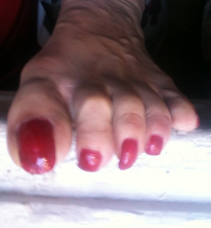 red toenails mix (older, dirty, toe ring, sandals mixed). #106916288