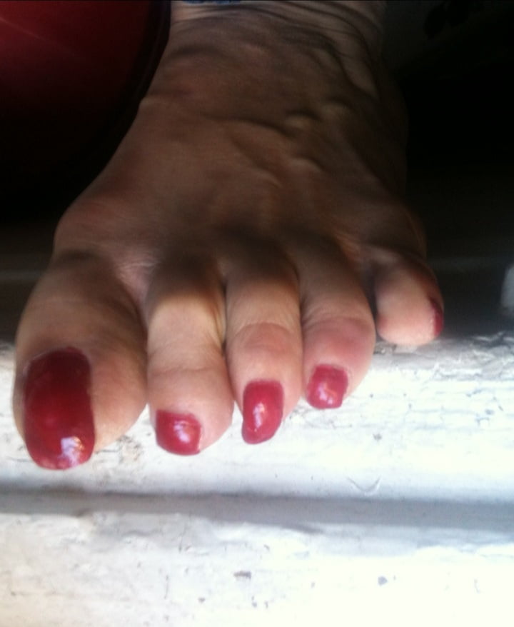 red toenails mix (older, dirty, toe ring, sandals mixed). #106916291