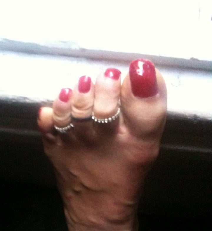 red toenails mix (older, dirty, toe ring, sandals mixed). #106916322