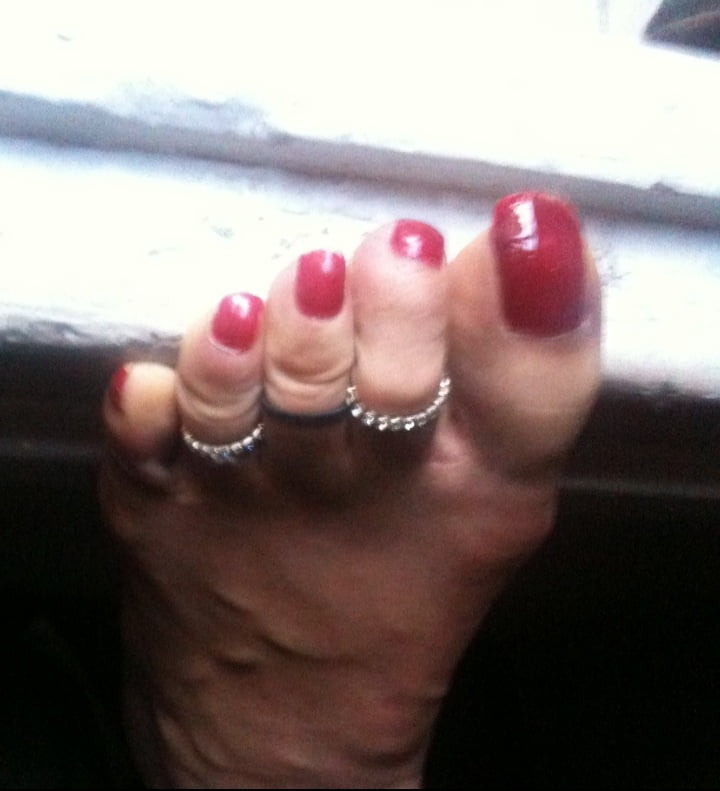 red toenails mix (older, dirty, toe ring, sandals mixed). #106916326