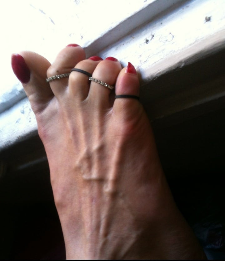 red toenails mix (older, dirty, toe ring, sandals mixed). #106916350