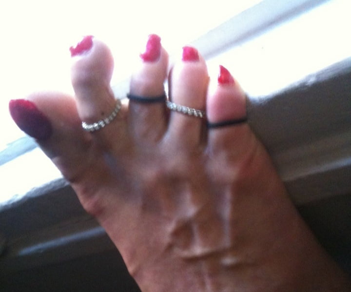 red toenails mix (older, dirty, toe ring, sandals mixed). #106916385