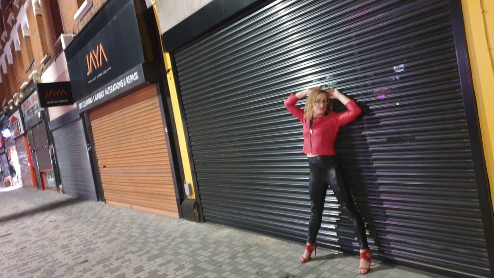 Leather clad street whore outside the sex club in London #106846670