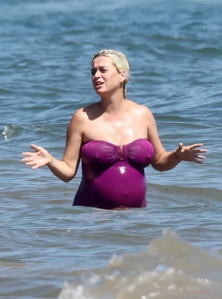 Pregnant Katy Perry in a purple swimsuit. #90290104