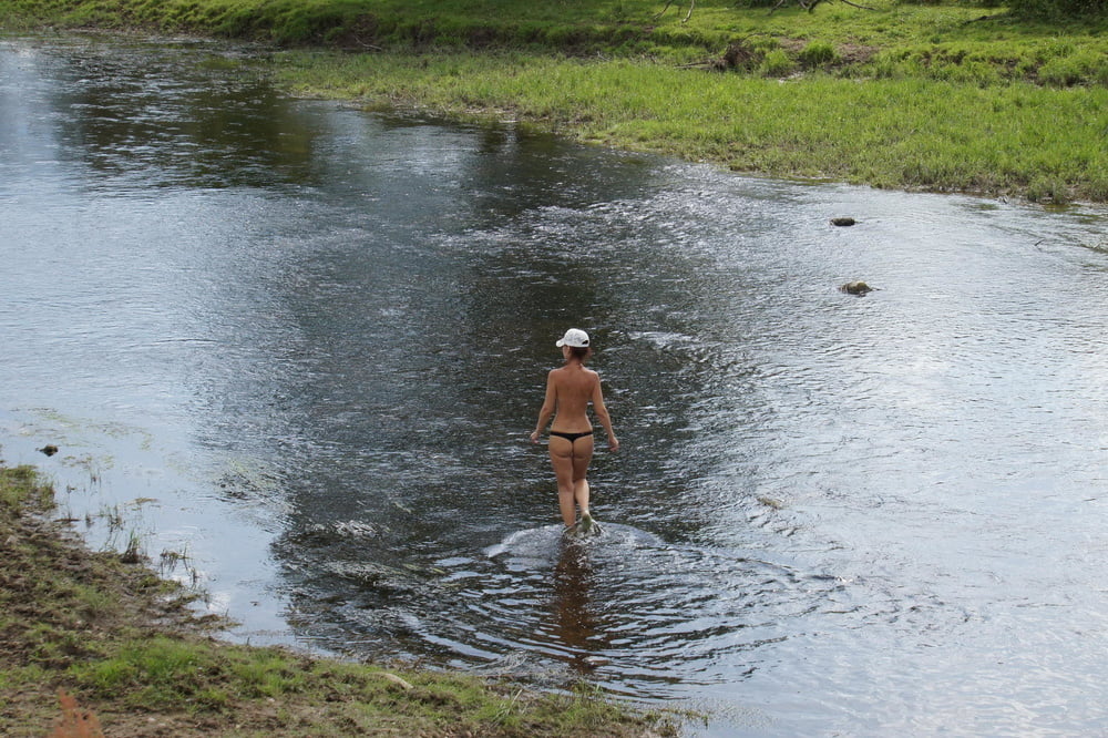 Nude in river&#039;s water #107282320