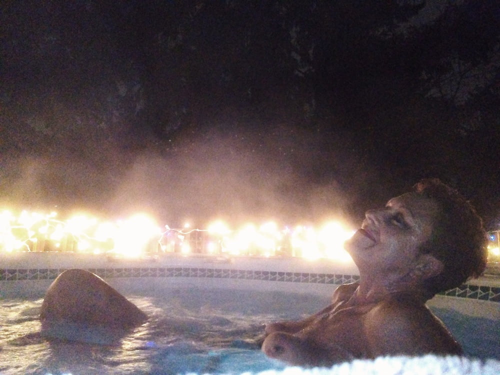 Nighttime hot tub fun #106796776
