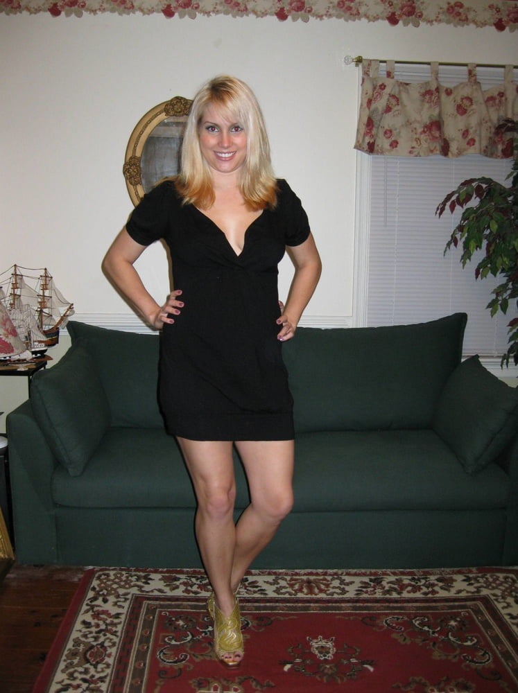 Blonde Showing Off In Her Little Black Dress #103068388